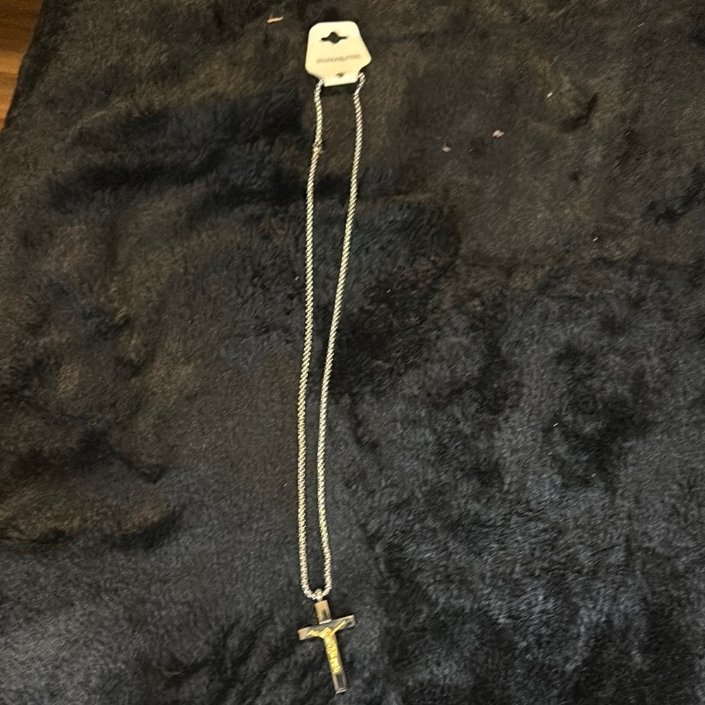 Elegant stainless steel necklace, and two tone, gold and silver crucifix pendant